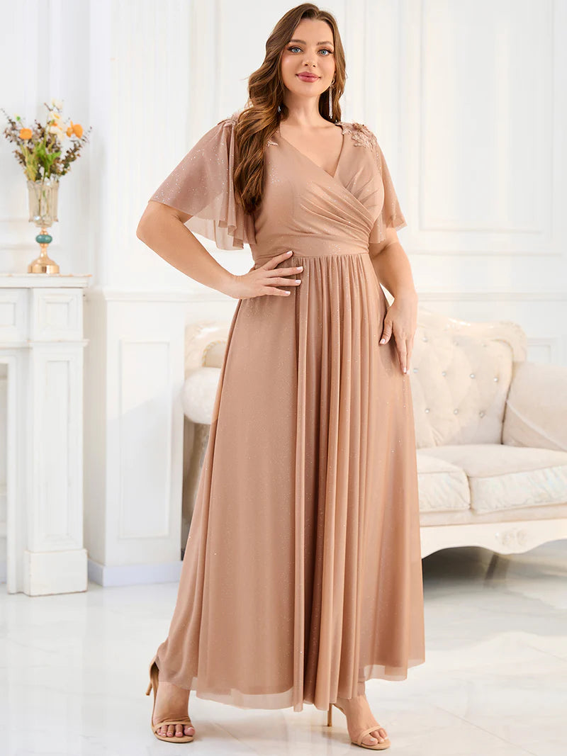 Rose gold plus size mother of the bride dress or formal dress with short sleeves.